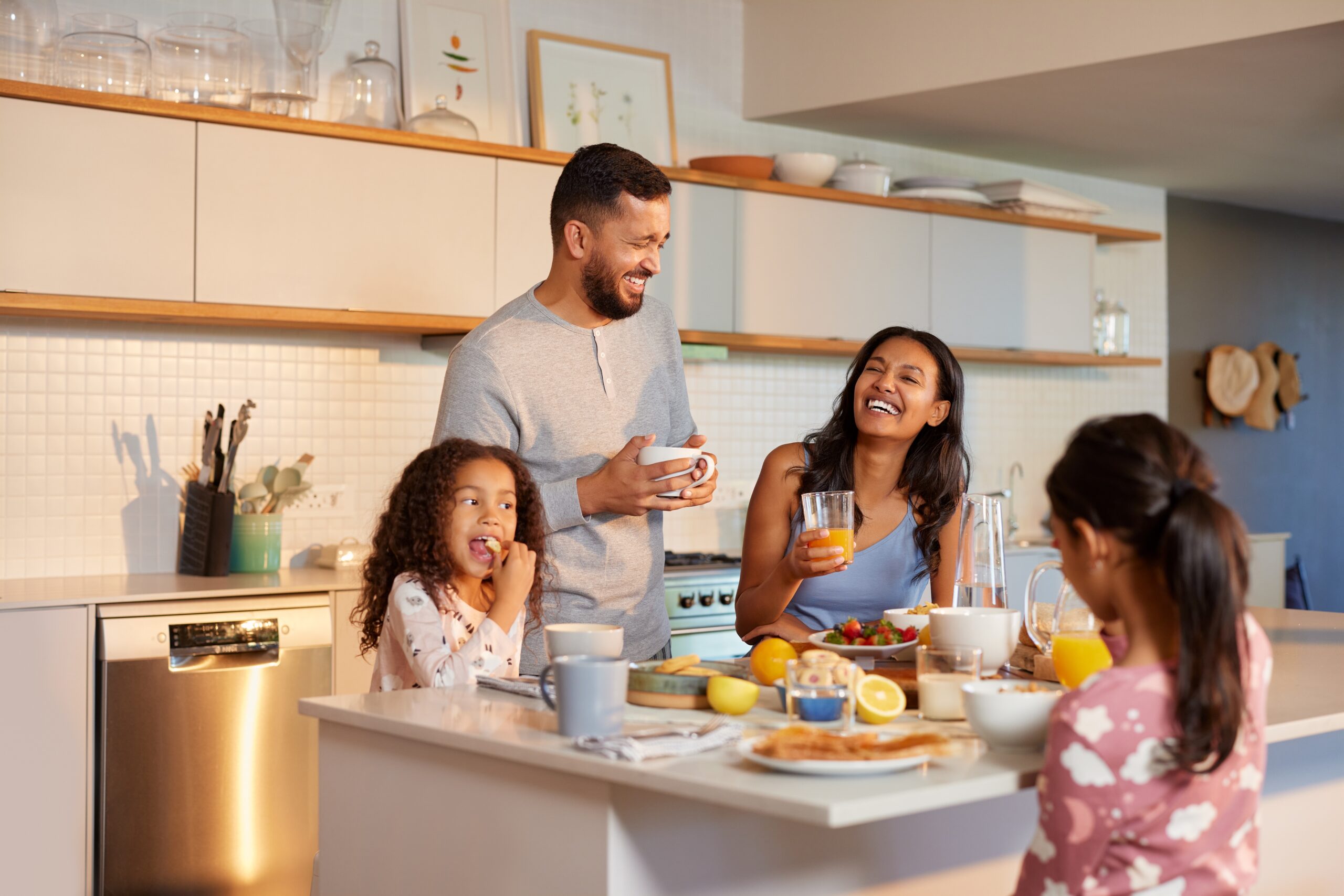 Hispanic,Family,Enjoy,A,Cheerful,Breakfast,Together,In,Modern,Kitchen.